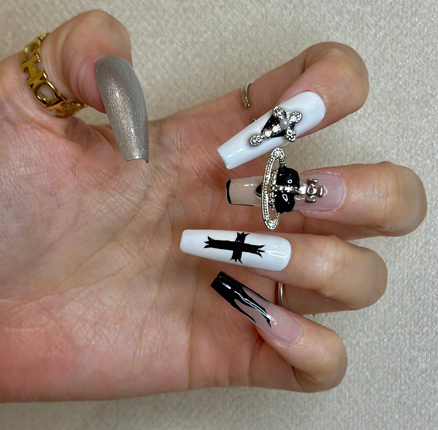 Punk girls' cross flame manicure in black white silvery painted nails