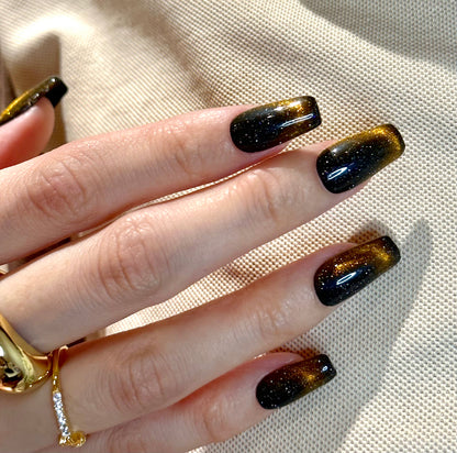 Cat eye black-brown meteor polar lights in dark sky manicure