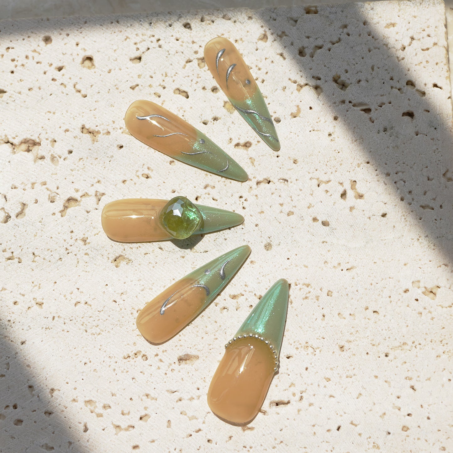 Marble green balls and floating leaves French tip nails