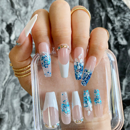 Hnad-painted Aqua ocean and white beach nails cool down in summer