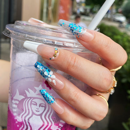 Hnad-painted Aqua ocean and white beach nails cool down in summer