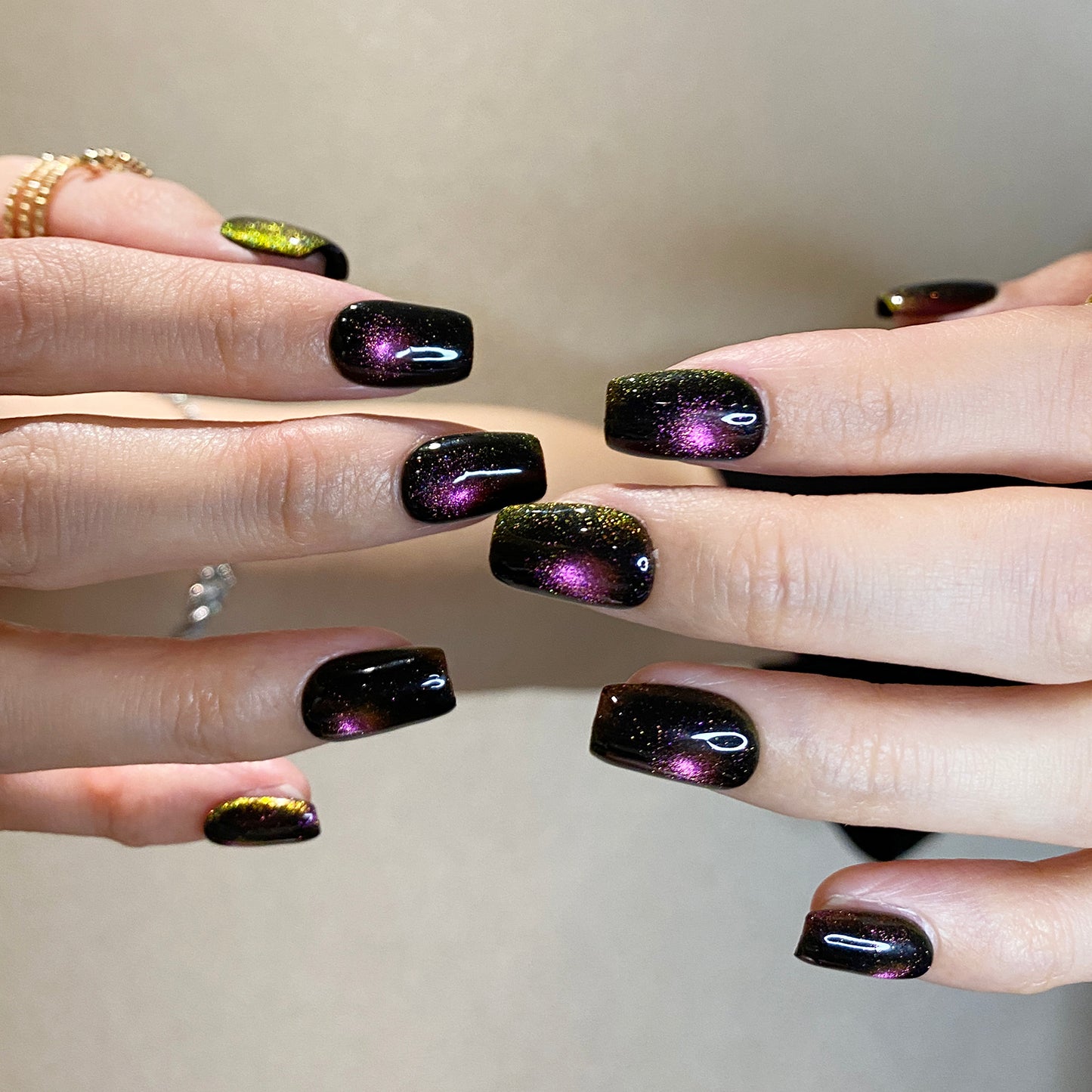 Cat eye fireworks in dark black purple-pink shiny nails