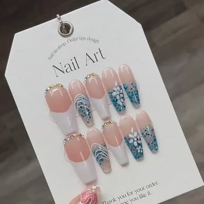 Hnad-painted Aqua ocean and white beach nails cool down in summer